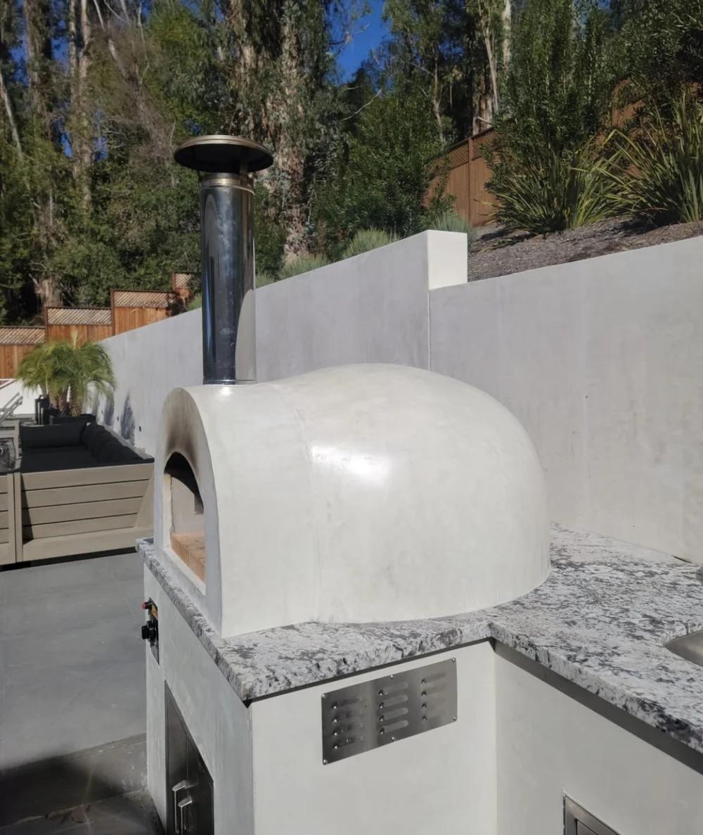 Smooth white plaster outdoor pizza oven